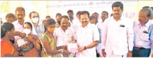 ponmudi distriute a certificate to people